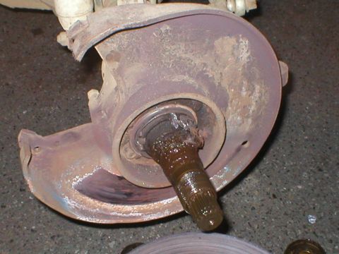 1978 Ford Bronco - Close-up of a corroded vehicle brake component, likely from an older truck or SUV.