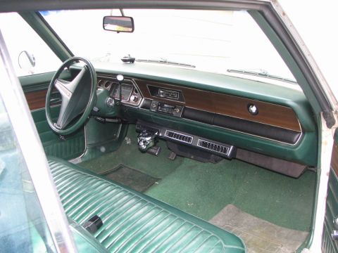 1975 Dodge Dart - Interior view of a 1975 Dodge Dart, showing the dashboard, steering wheel, and front seating.