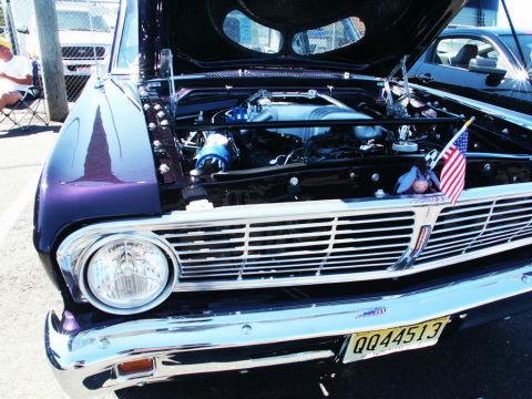2001 Mercury Grand Marquis - Front view of a 1964 Ford Falcon with hood open, showing the engine and grille.