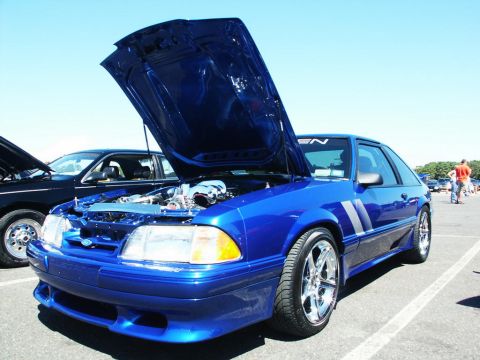 2001 Mercury Grand Marquis - A blue coupe with its hood open at a car show, revealing the engine and custom modifications.