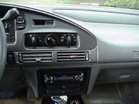 1993 Ford Taurus - Interior view of a car's dashboard, focusing on the center console and radio.