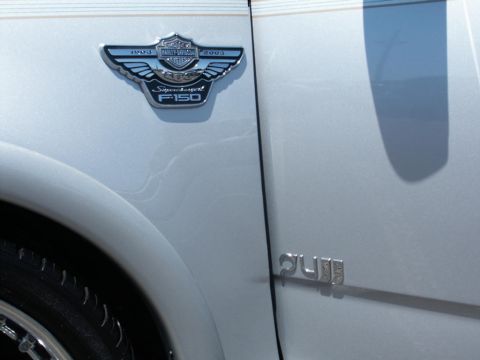 2001 Mercury Grand Marquis - This badge indicates a 2003 Harley-Davidson F-150 Supercharged model, contradicting the registry's claim of a 2001 Mercury Grand Marquis.