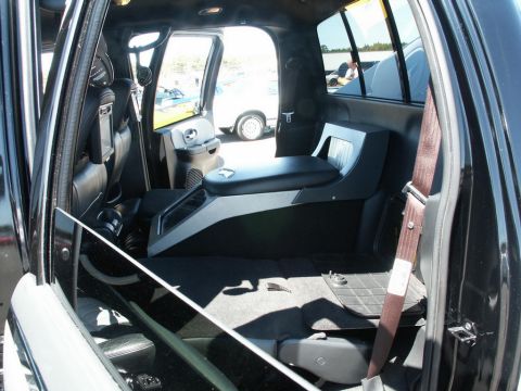 2001 Mercury Grand Marquis - Customized interior of a vehicle with a unique center console and rear seating area.