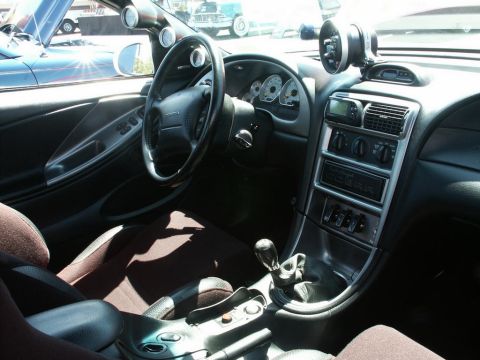 2001 Mercury Grand Marquis - Car interior shows aftermarket gauges and a "COBRA" emblem on the center console.