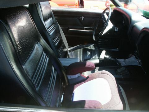 2001 Mercury Grand Marquis - Interior view of a car's front seats, dashboard, and steering wheel.