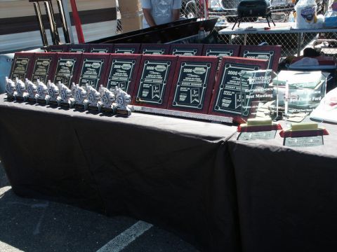 2001 Mercury Grand Marquis - A table displays numerous trophies and awards, many indicating '2006 Event Winner' or 'Best Mustang'.