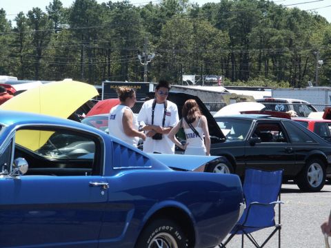 2001 Mercury Grand Marquis - Cars at a show with people gathered around.