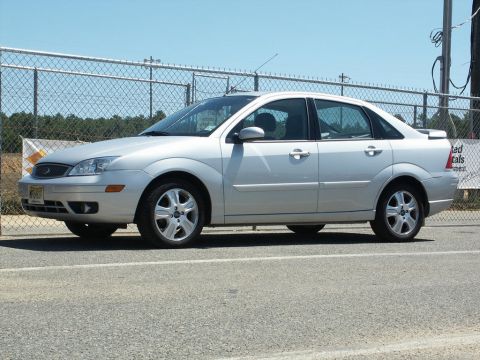 2001 Mercury Grand Marquis - A silver sedan is parked outdoors, viewed from the side. The vehicle appears to be a Ford Focus from the early 2000s.