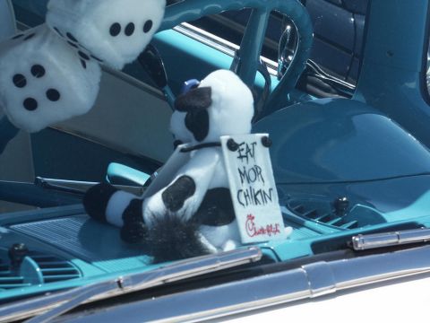 2001 Mercury Grand Marquis - Interior view of a classic car plush dice and a stuffed cow toy with a Chick-fil-A sign.