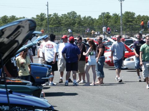 2001 Mercury Grand Marquis - Outdoor car show with multiple vehicles and spectators milling around.
