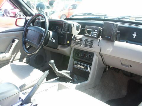 2001 Mercury Grand Marquis - Interior view of a car with a manual transmission and various electronic devices mounted on the dashboard.