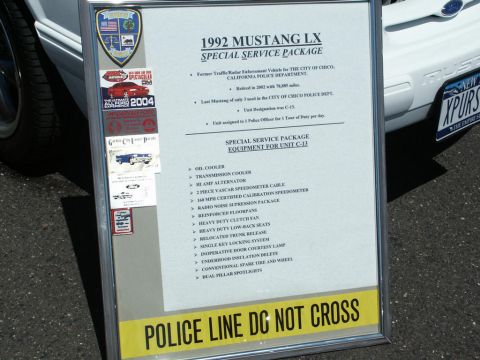 2001 Mercury Grand Marquis - Car-show board listing the 1992 Mustang LX SSP police-package equipment and specifications.