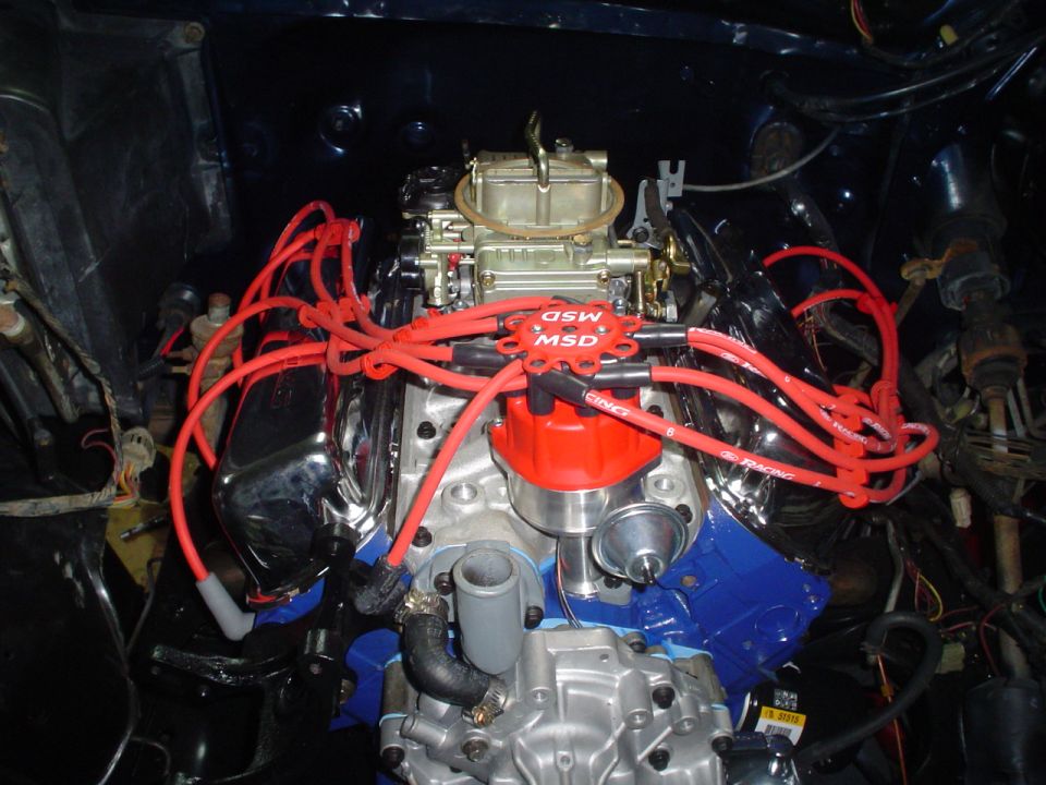 Engine bay with MSD distributor and red spark plug wires