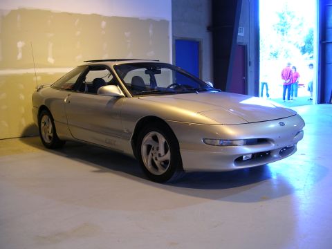 1996 Ford Probe - A silver 1996 Ford Probe GT is parked inside a garage with the doors open.
