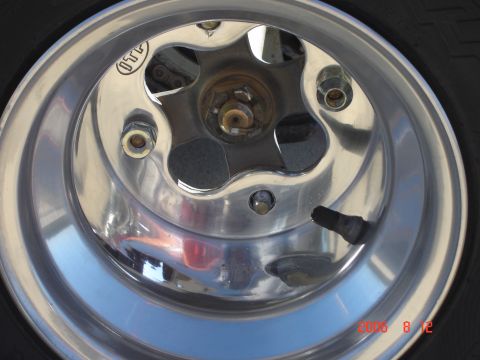 1993 Ford Bronco - Close-up of a chrome wheel with a visible 'OTT' logo and tire.