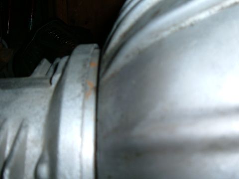 1985 Ford Bronco II - Close-up view of a metal engine component, possibly part of a transmission or differential.