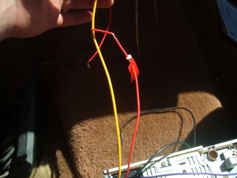 1988 Ford Bronco - Wiring is visible for a car stereo installation, with red and yellow wires connected.