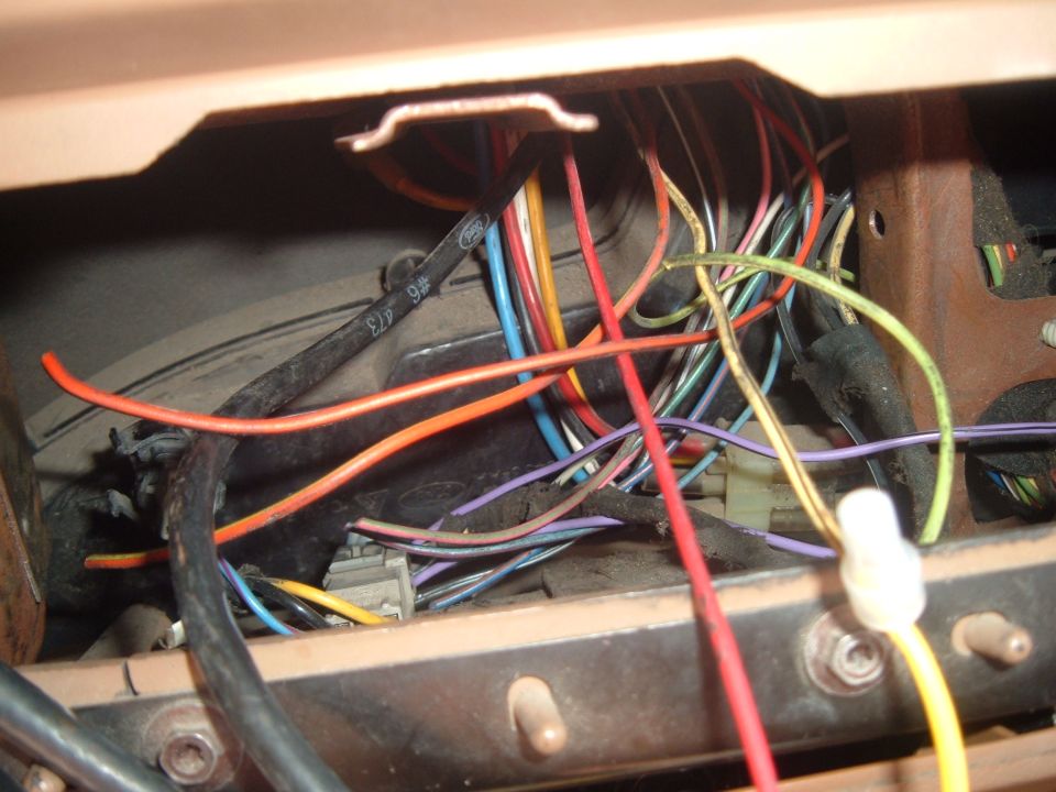 Vehicle wiring harness with many colored wires and connectors visible