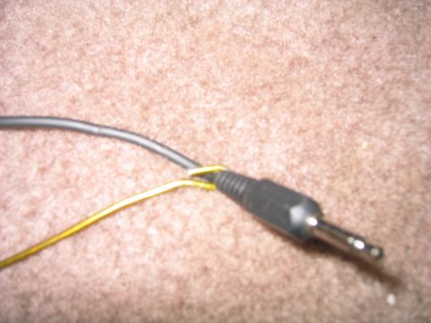 1996 Ford Bronco - wrap a wire around the coathanger and push it through one of the holes in the carpet