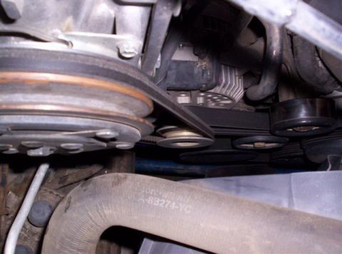 1995 Ford Bronco - Engine bay view showing multiple belts and pulleys, with a hose labeled A-B3274-YC.
