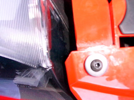 2000 Ford Mustang - closeup shot of the screw on either side of the fascia....I also added two flat head screws to attach the inner fender wells to the fascia…