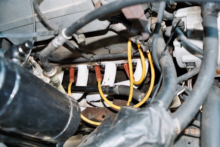 1991 Ford Bronco - Engine bay detail showing spark plug wires and connections.