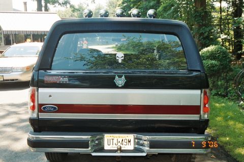 1991 Ford Bronco - Rear view of a 1991 Ford Bronco, showing its distinctive body style and rear bumper.
