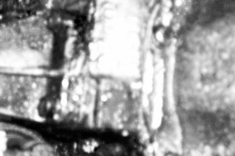1975 Ford F-150 - Extremely blurred, washed-out grayscale close-up with no discernible subject, only vague light and dark shapes and speckling. Nothing ident…