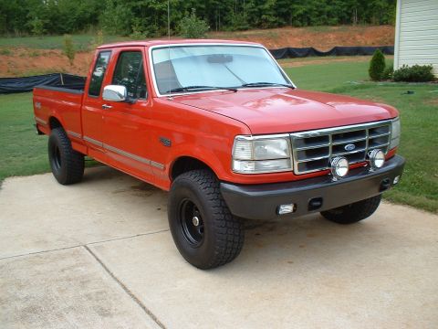 1995 Ford F-150 - Here's the painted bumper with new fog lights and spot lights. I also removed the chrome wheel well trim.