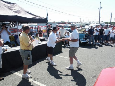 2001 Mercury Grand Marquis - Attendees gather at a car show as an award is presented to a participant.