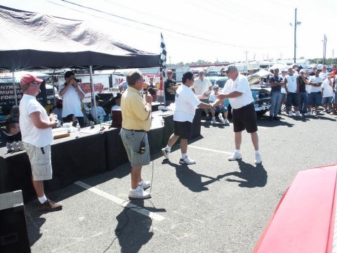 2001 Mercury Grand Marquis - Award ceremony at a car show with spectators and a checkered flag visible.