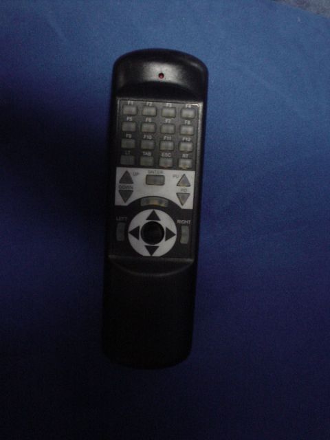 1995 Ford Probe - This is a remote control with many function buttons and directional controls.