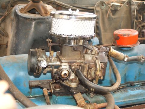 1966 Ford Ranchero - The engine bay shows a carburetor with an aftermarket chrome air filter assembly.