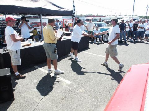 2001 Mercury Grand Marquis - Awards are presented at a car show with a crowd gathered and vehicles visible.