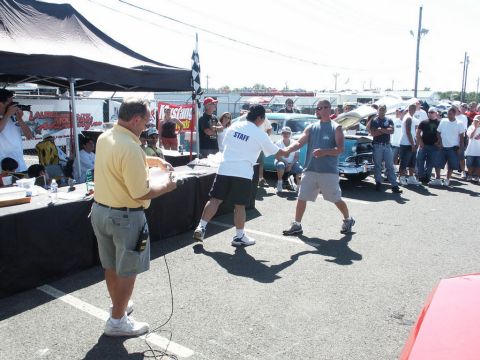 2001 Mercury Grand Marquis - Award ceremony at a car show with spectators and a classic car visible.
