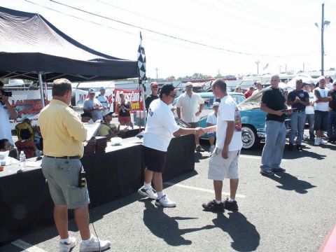 2001 Mercury Grand Marquis - Award ceremony at a car show with a classic blue car visible in the background.
