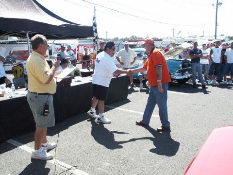 2001 Mercury Grand Marquis - Award ceremony at a car show with a classic car visible.