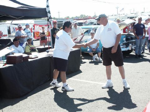 2001 Mercury Grand Marquis - Award ceremony at an outdoor car show with multiple vehicles visible.