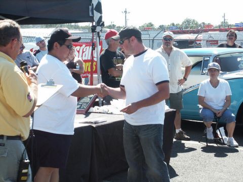 2001 Mercury Grand Marquis - Award ceremony at a car show with a vintage car visible in the background.
