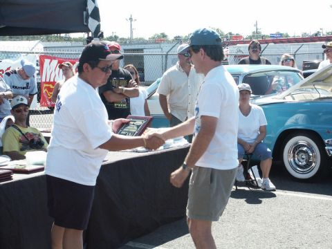 2001 Mercury Grand Marquis - Awards are presented at a car show with a vintage turquoise car in the background.