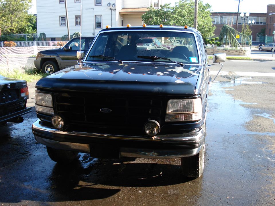 Black 1994 Ford Bronco front view with chrome bumper and grille