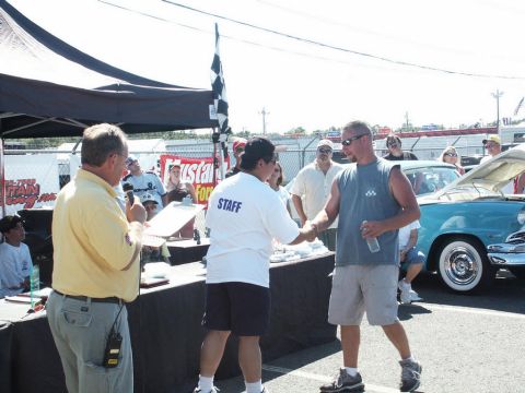 2001 Mercury Grand Marquis - Award ceremony at a car show with a vintage car visible.