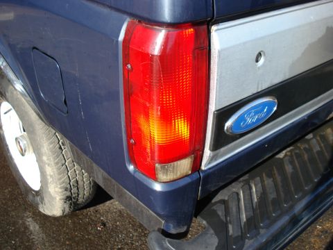 1994 Ford Bronco - Close-up of the rear tail light and Ford emblem on a 1994 Ford Bronco.