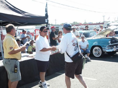2001 Mercury Grand Marquis - Award presentation at a car show with a vintage car in the background.