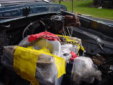 1979 Ford Bronco - Engine bay components are covered for protection during work or transport.