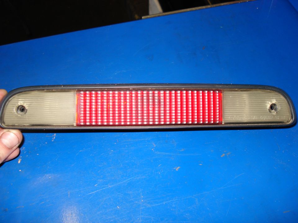Car's third brake light assembly with red and clear sections