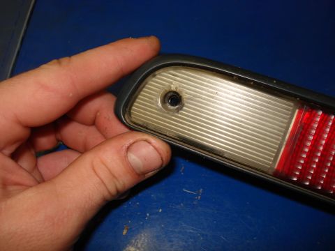 1994 Ford Bronco - Close-up of a vehicle taillight assembly, showing the clear and red lens sections.