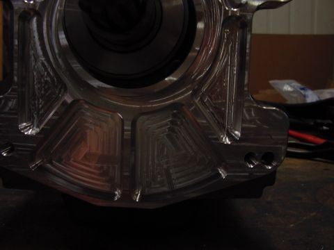1979 Ford Bronco - Close-up view of a custom-machined metal adapter, detailed geometric milling.