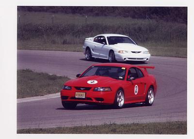 2000 Ford Mustang - Ken ('00 Cobra R) and Lew ('95 Cobra R) at Gingerman Raceway, South Haven, Michigan....Open-tracking with the SVT Cobra Club on 06/09/02