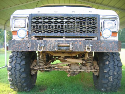 1992 Ford Mustang - Modified Ford truck front end with off-road tires and winch. Likely a 1979 model based on grille and headlight design.